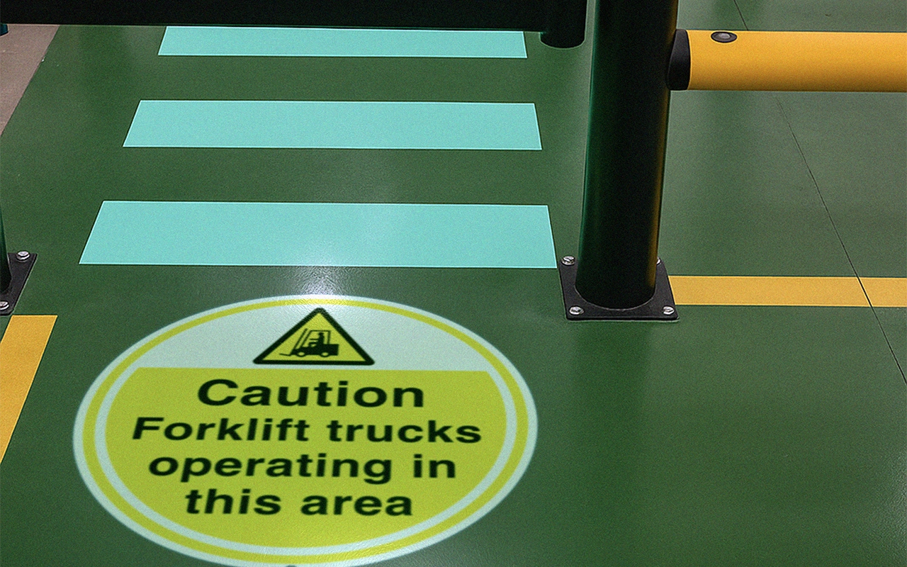 projected safety walkway and crosswalk in a facility