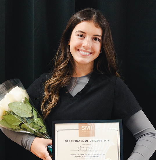 Aesthetics student consulting with client at The Skin + Makeup Institute spa