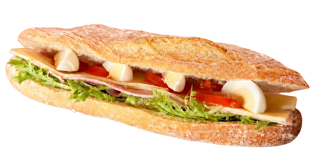 Baguette garnie de laitue, tranches de jambon, fromage, œufs durs et tomates.