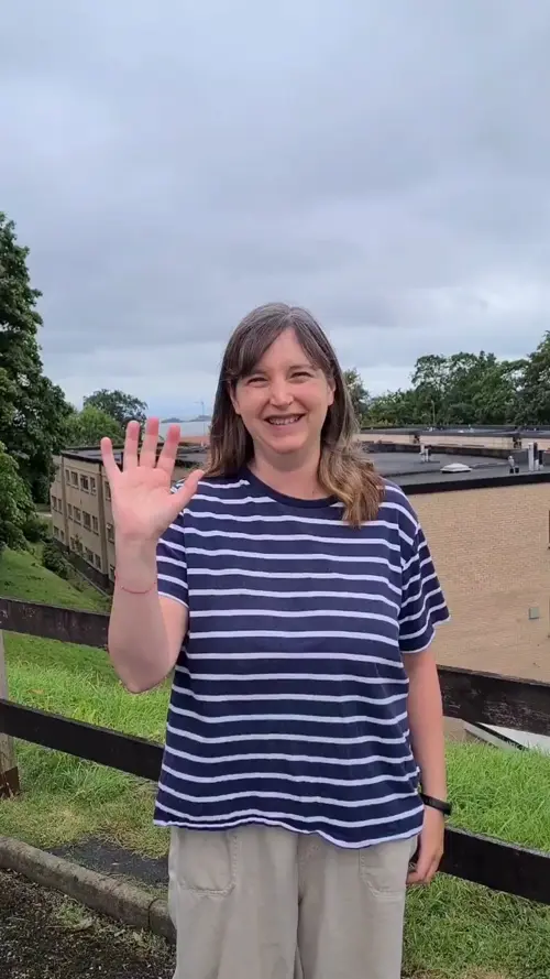 Madeline waving