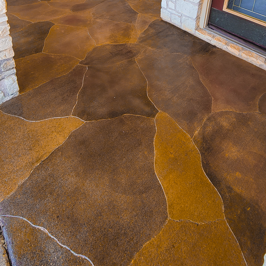 Concrete patio floor outside a modern steel home