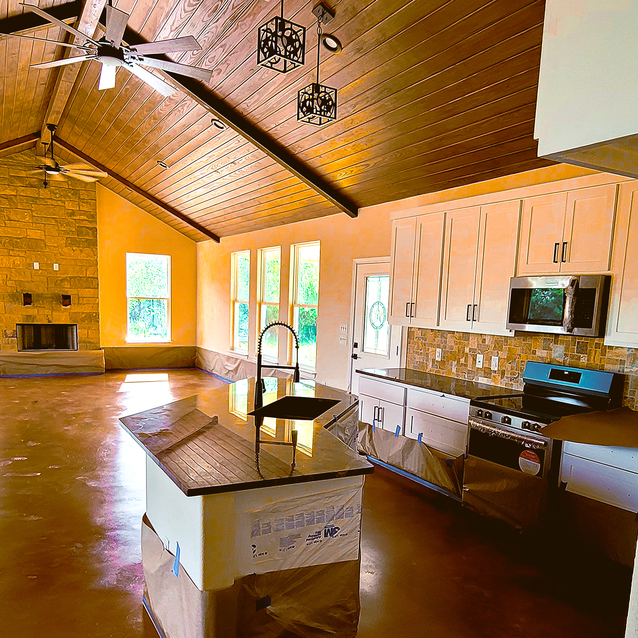 Modern living room with polished concrete floor and natural wood walls