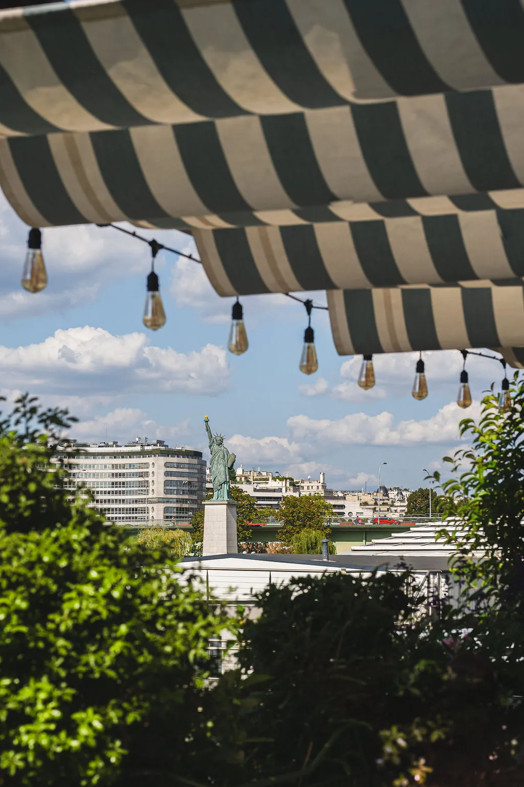 Terrace on the banks of the Seine at La Plage Parisienne with a view of the Statue of Liberty, Beaumarly House