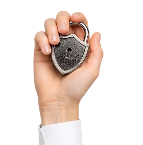 Hand holding a metal shield-shaped padlock with a keyhole in the center.