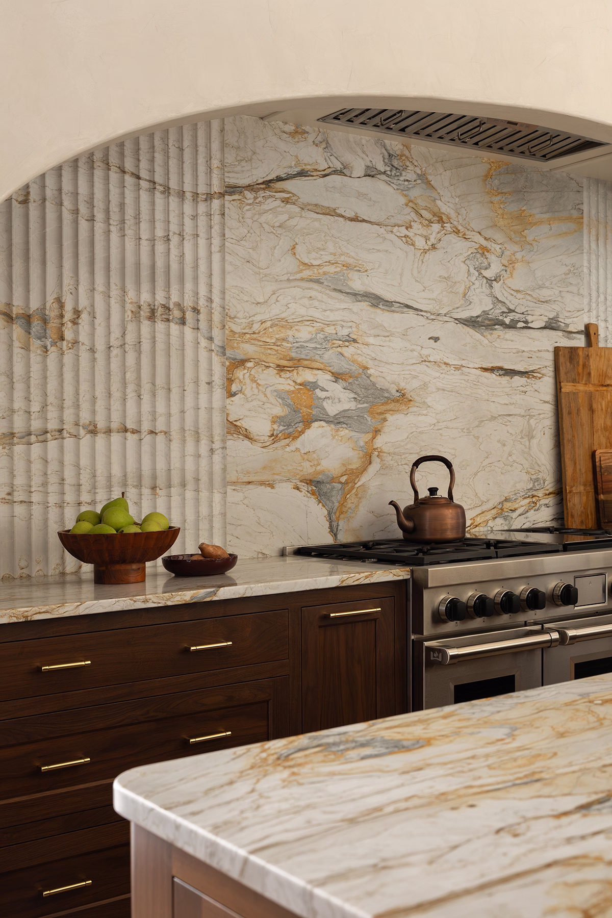 range alcove with marble slab backsplash