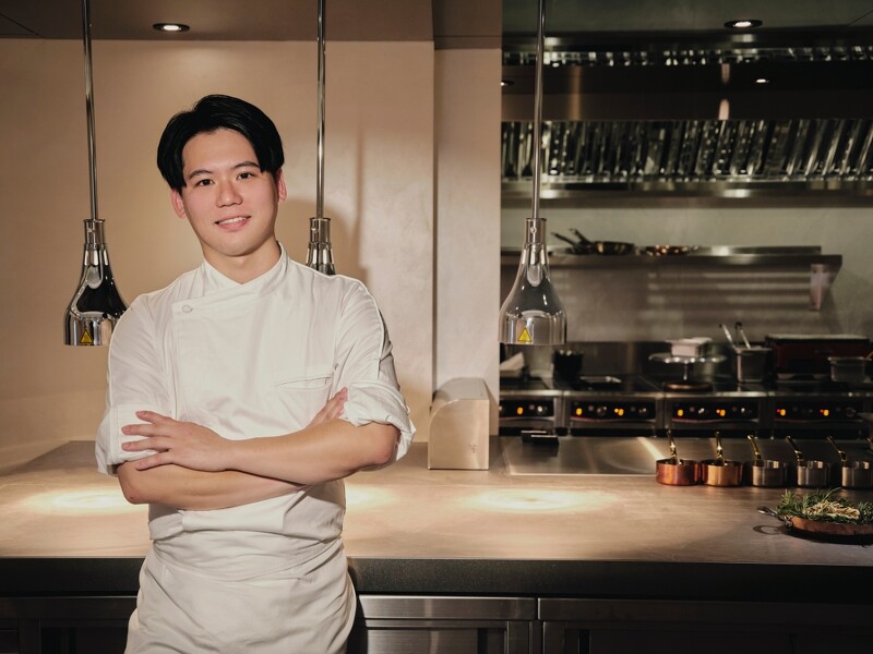 chef posing in front of a kitchen working station