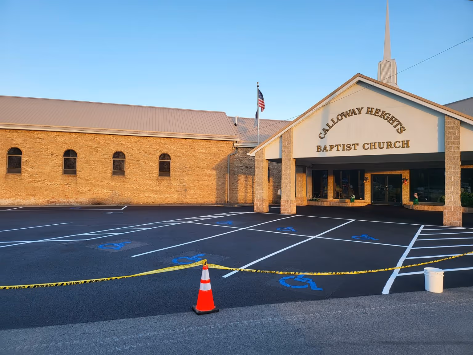 Newly paved and striped driveway outside of a church.
