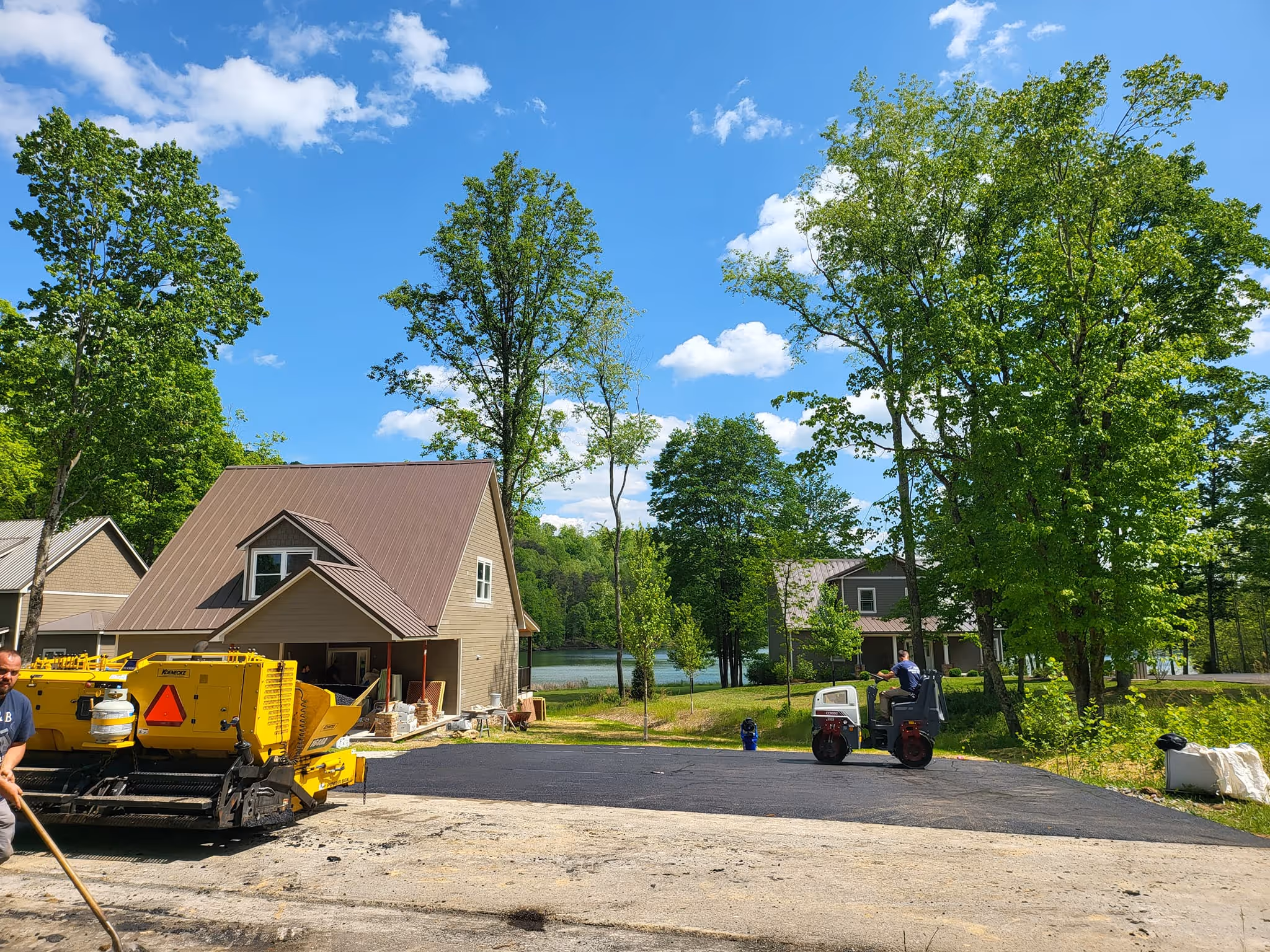 A home with a freshly paved driveway