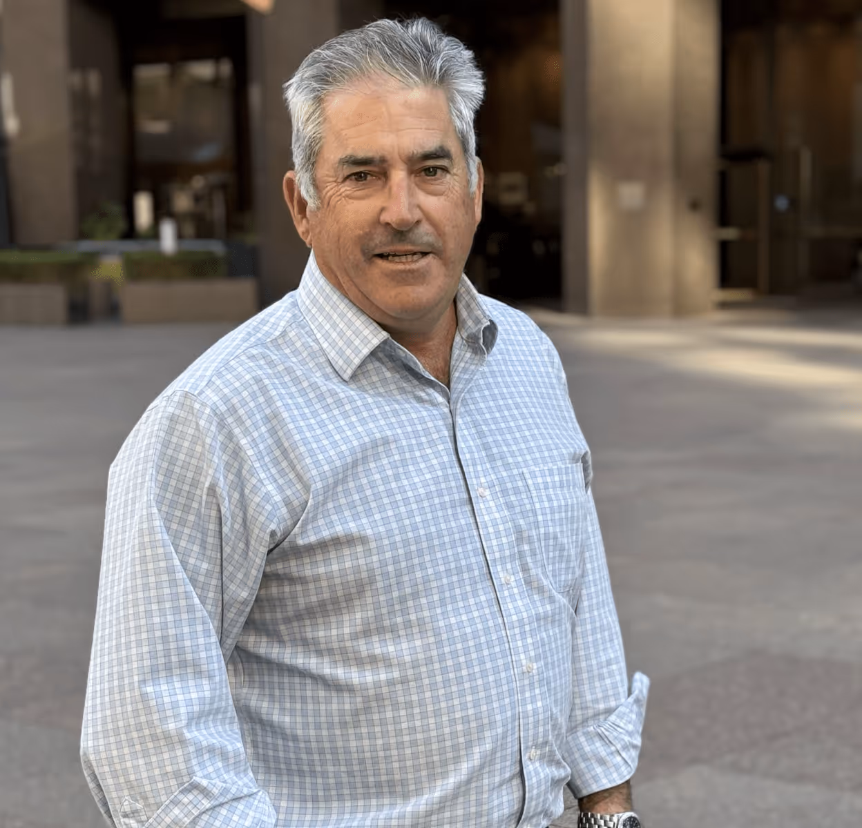 Image of Brian Muller standing in front of a building.