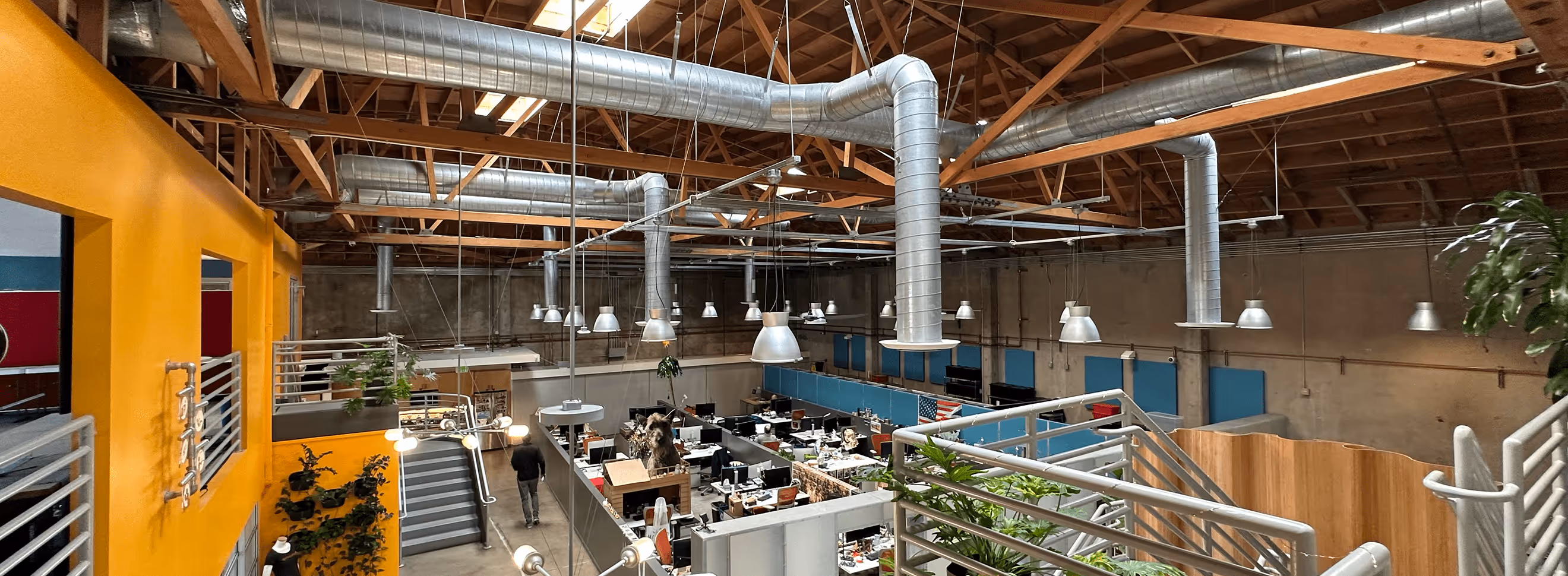 A building with a bunch of tables and chairs inside of it.