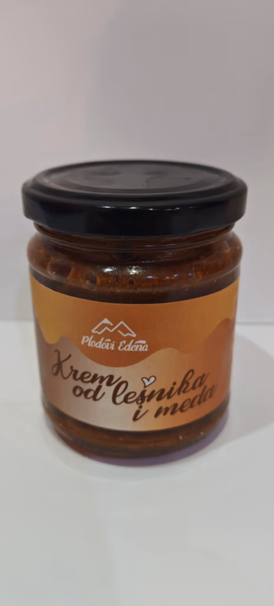 a jar of food on a white surface