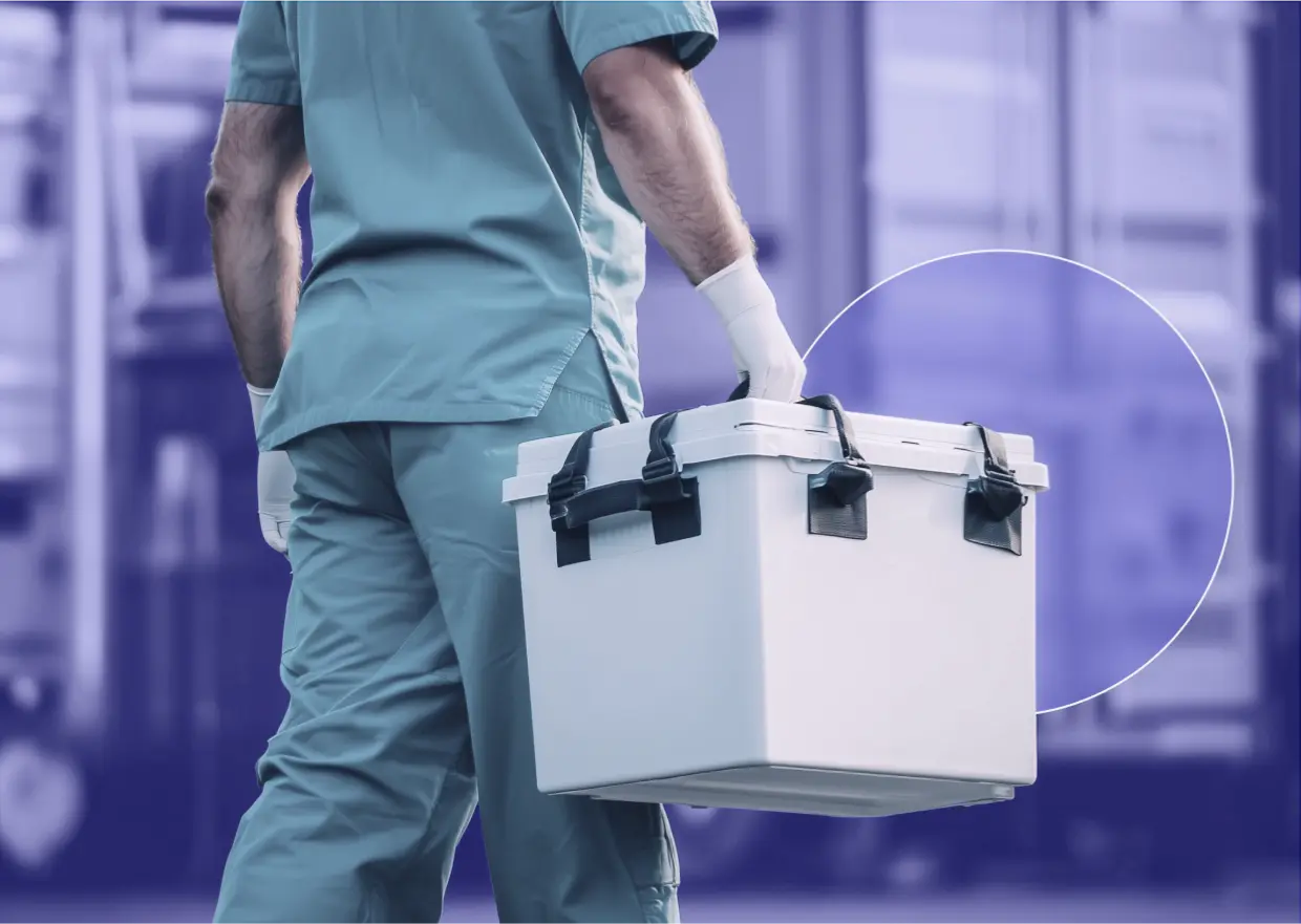 Medical professional carrying a cooler for organ transport