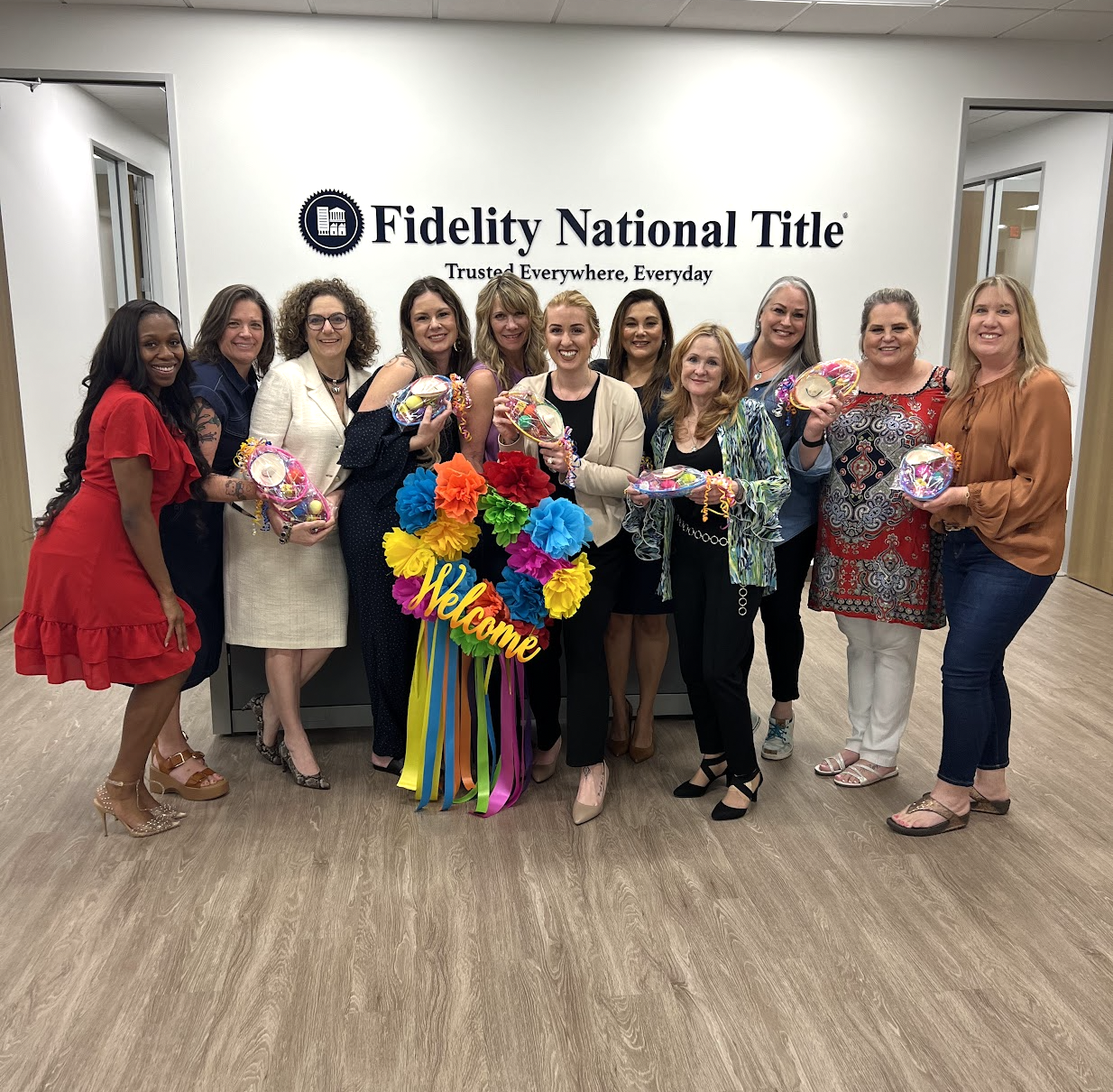 Image of Lauren Krailo and other women at Fidelity national title after a speaking event featuring Lauren Krailo