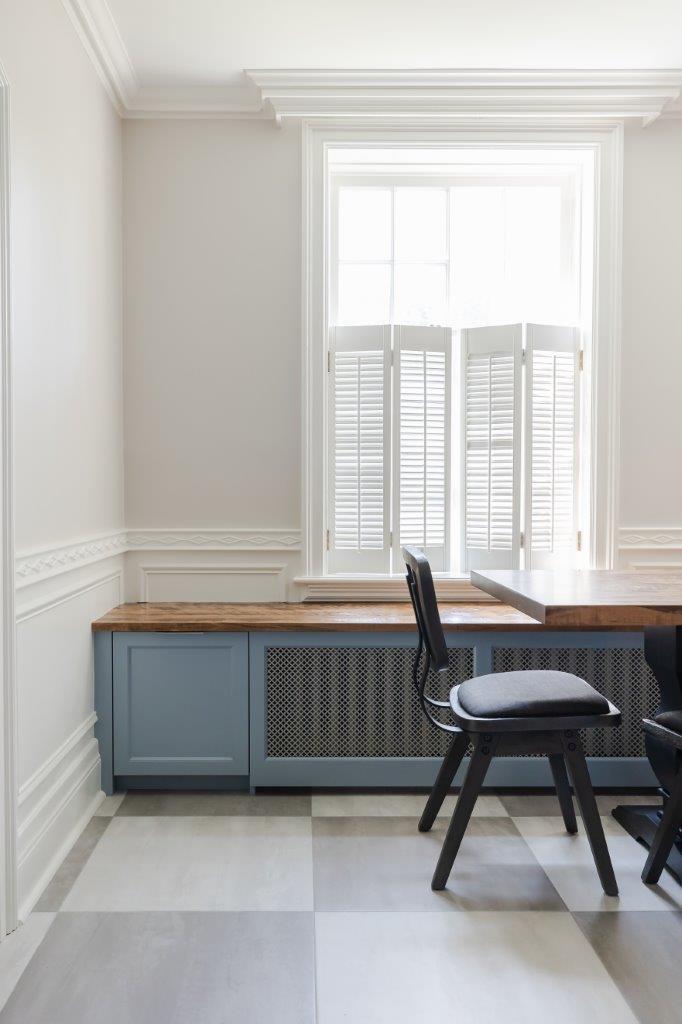 Built-in bench to conceal unappealing radiators while offering added seating and extra storage.