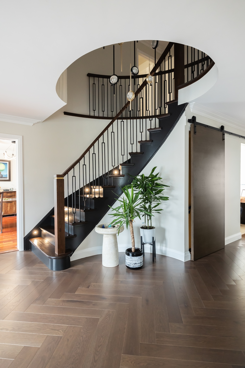 The addition of tiny lights inset into the stringer along the wall created even more drama and sparkle with the low-contrast finishes.