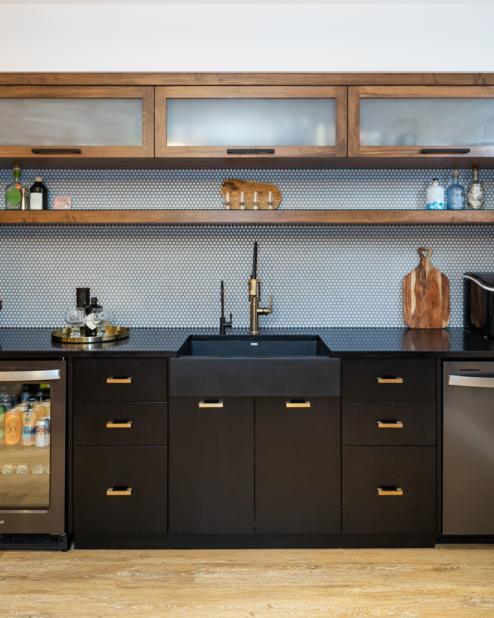 The built-in LED lighting for function also lends a spotlight to feature a collection of gin bottles from their travels around the world.