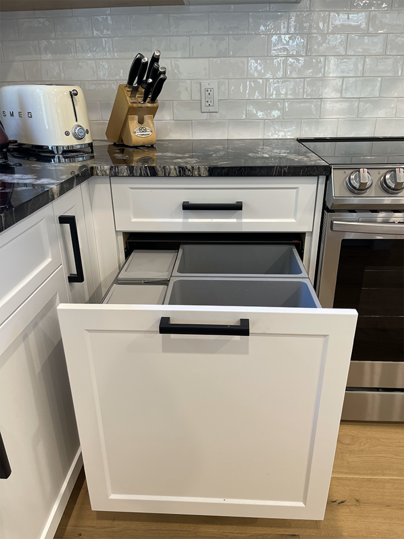 Reduce waste with a dedicated section for built-in recycling and compost storage.