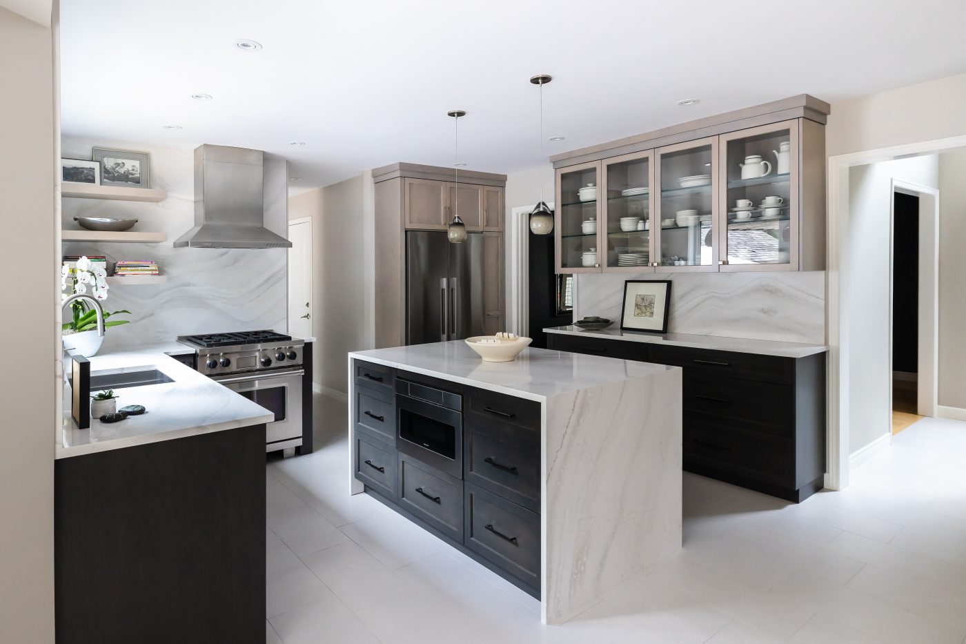 Dramatic backsplashes and countertop can really make a kitchen pop with personality.