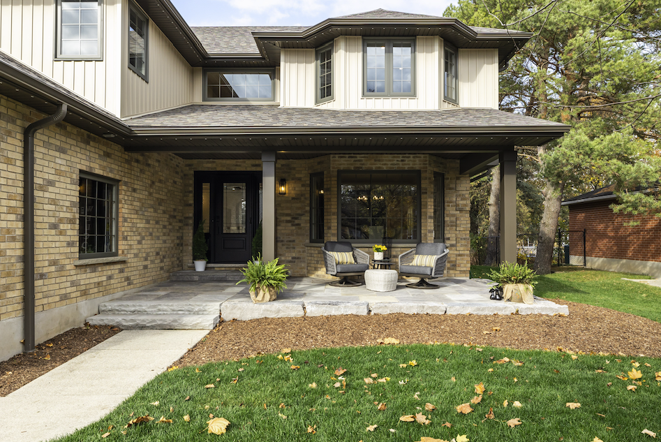 The new covered front patio not only elevated the curb appeal but proclaims this family is ready to welcome you into their home.
