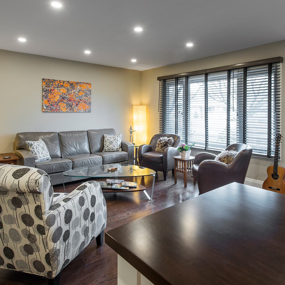 Where there once was a seating area in the living room, darkened by the overhang on the front porch, there is now ambient light flowing in from the living room window through the kitchen and hallway.
