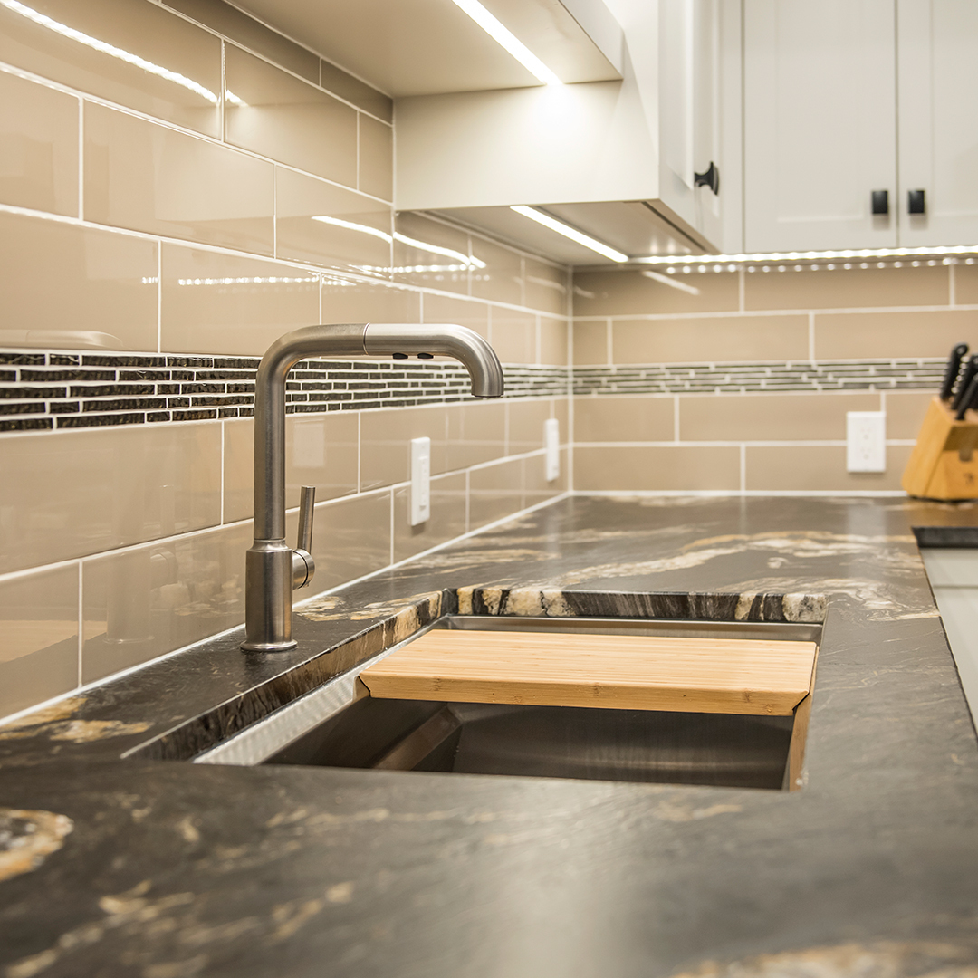 Custom cutting board fits perfectly over the sink for easy meal prep.