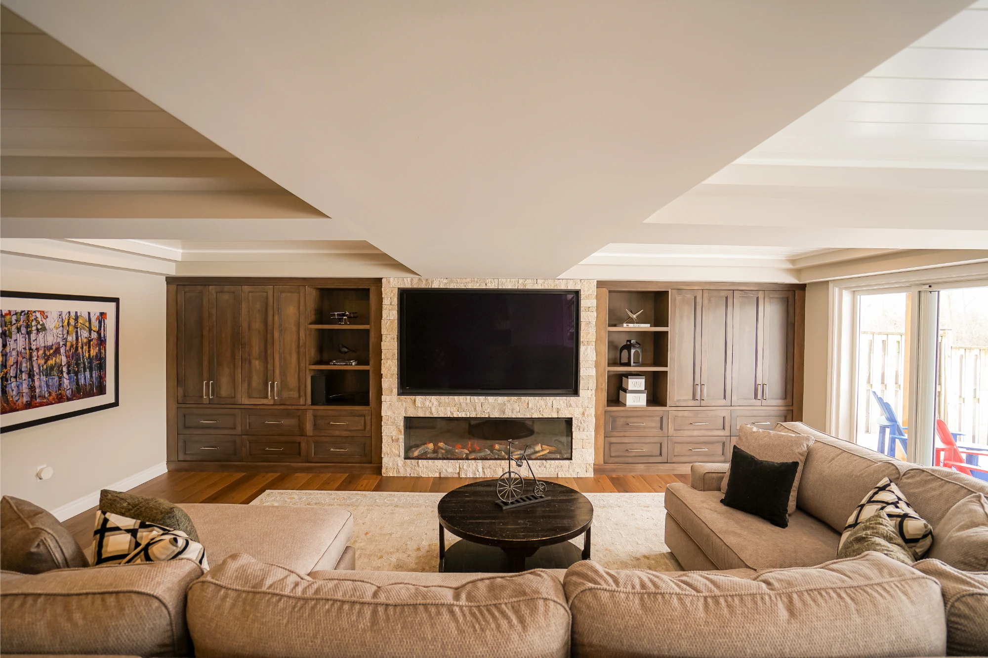 Before and after renovation comparison - Maximizing Family Living: A Thoughtful Basement Addition with Outdoor Flow  by Pioneer Craftsmen