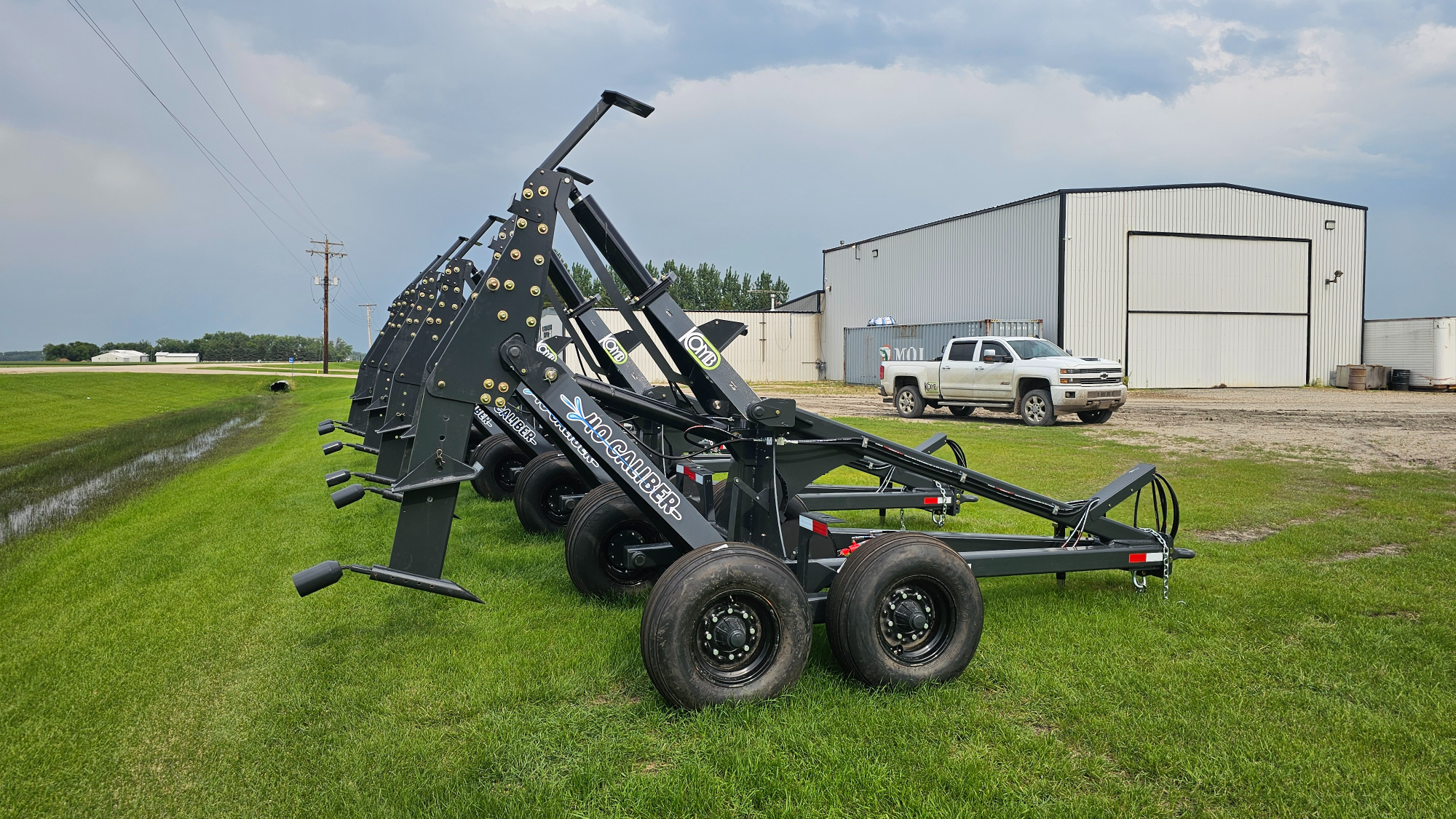 A lineup of Mole Plows on a lot