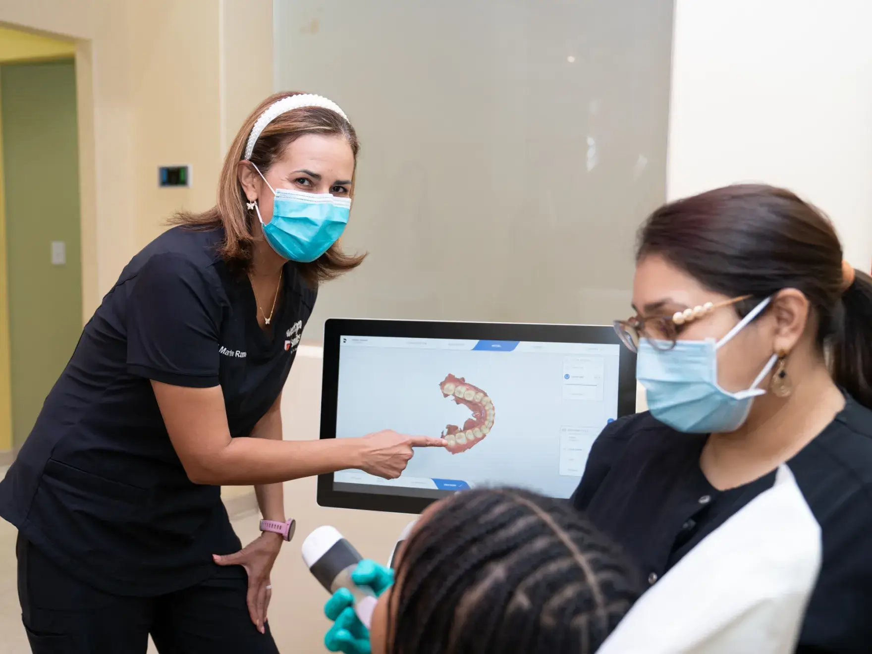 a group of women in scrubs and face masks