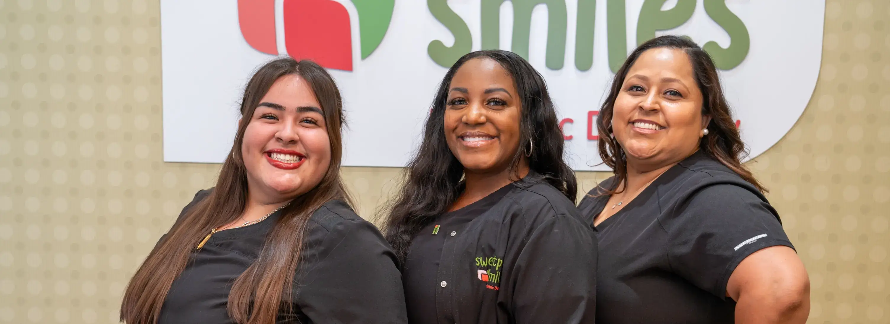 a group of women standing next to each other