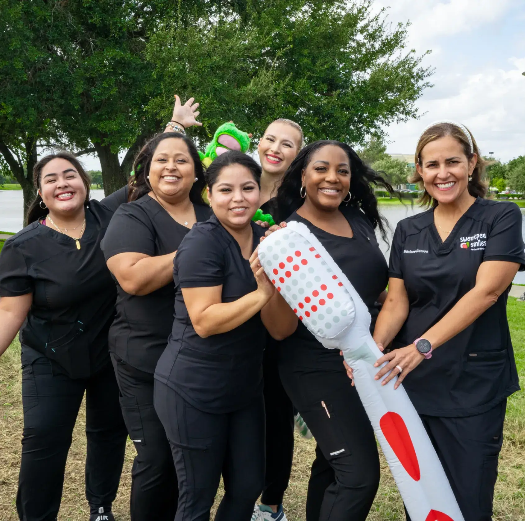 a group of women standing next to each other