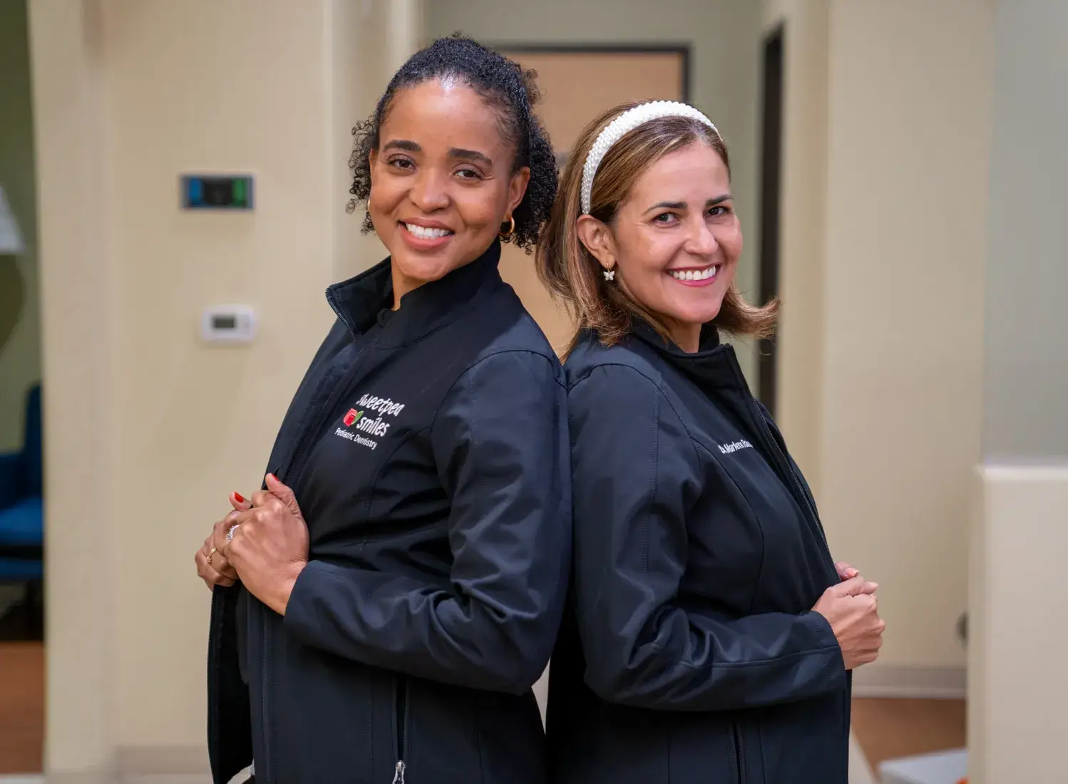 a couple of women standing next to each other
