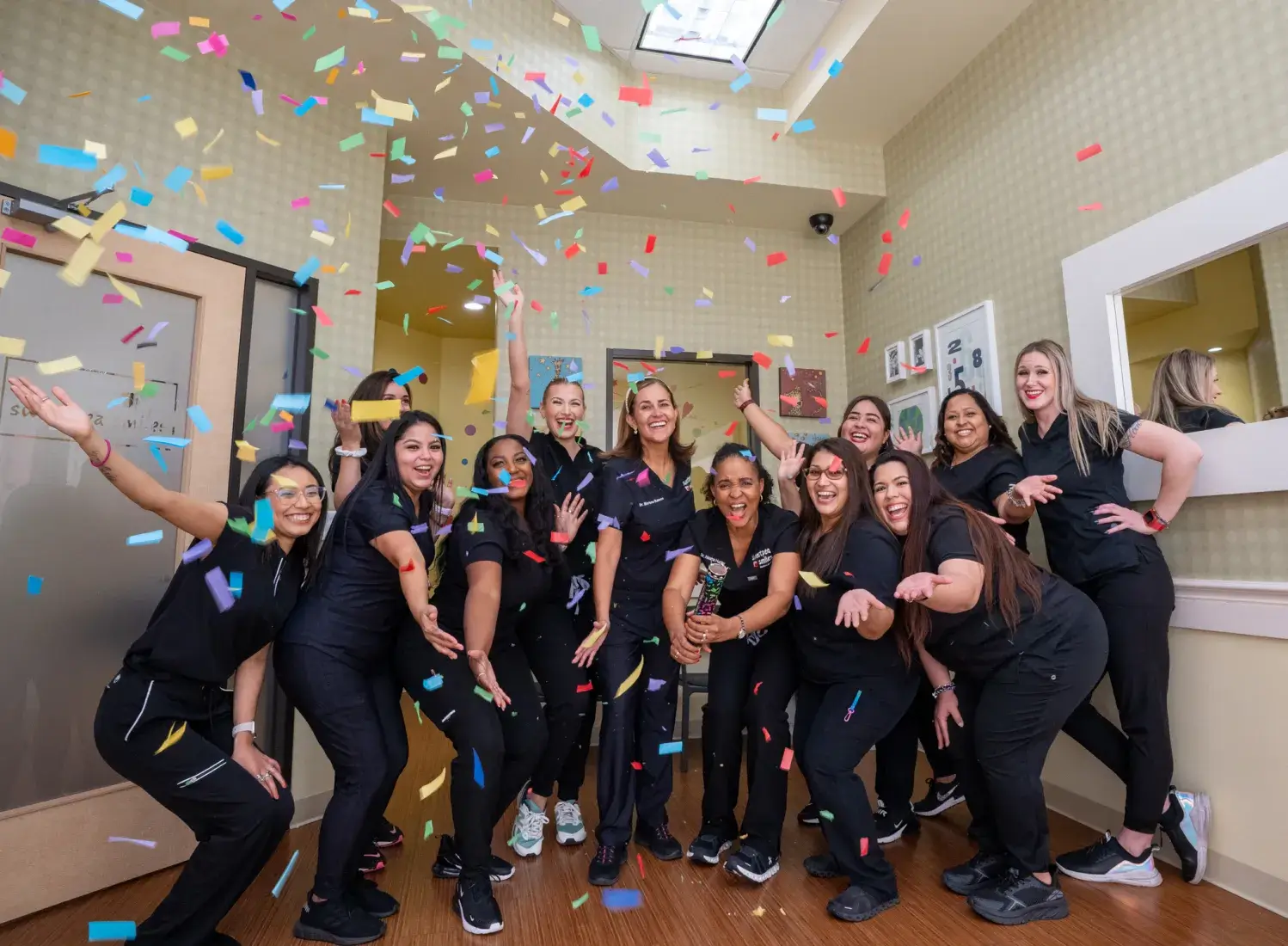 a group of women in scrubs posing for a picture
