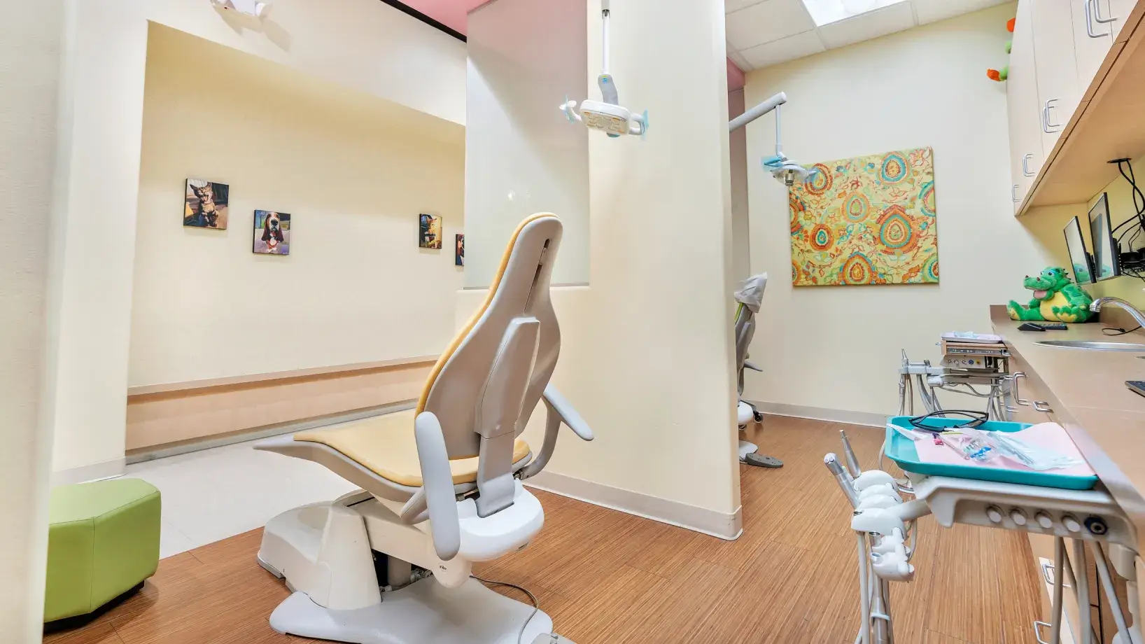 a dentist's office with a chair in the middle of the room