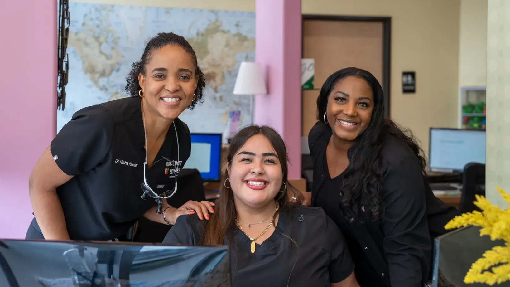 a group of women standing next to each other