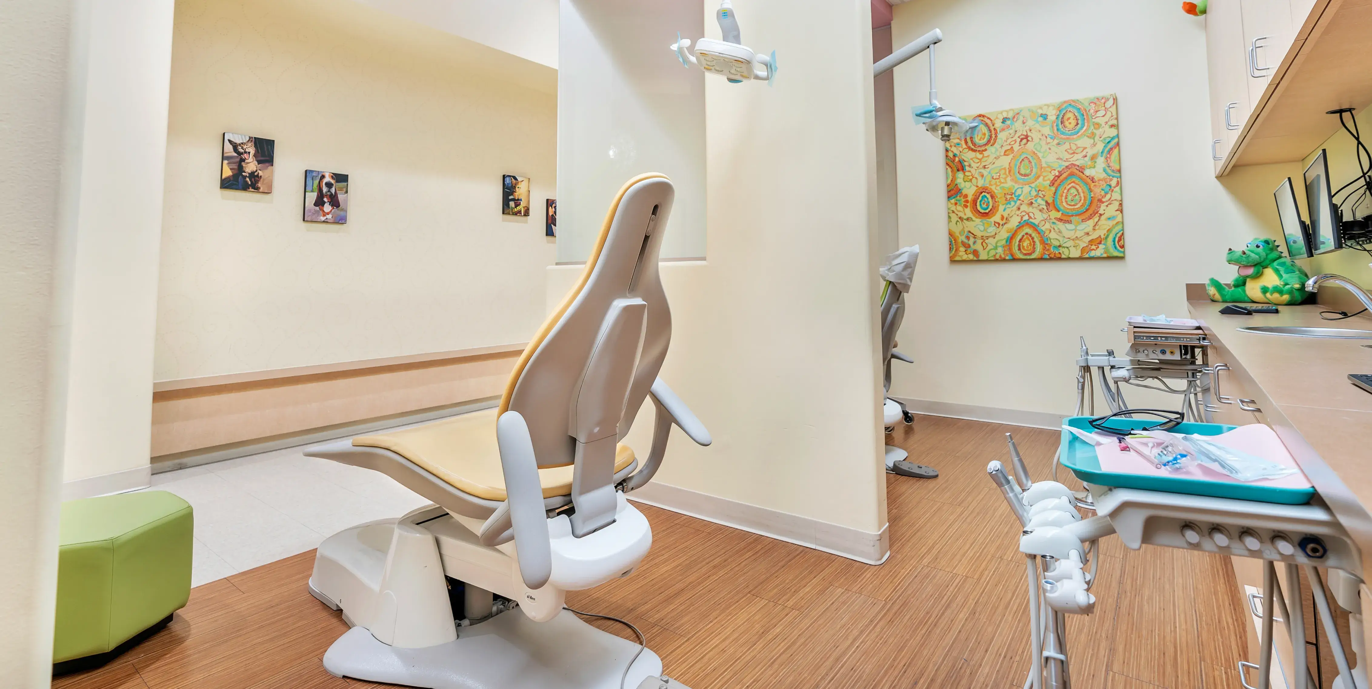 a dentist's office with a dental chair in the middle of the room