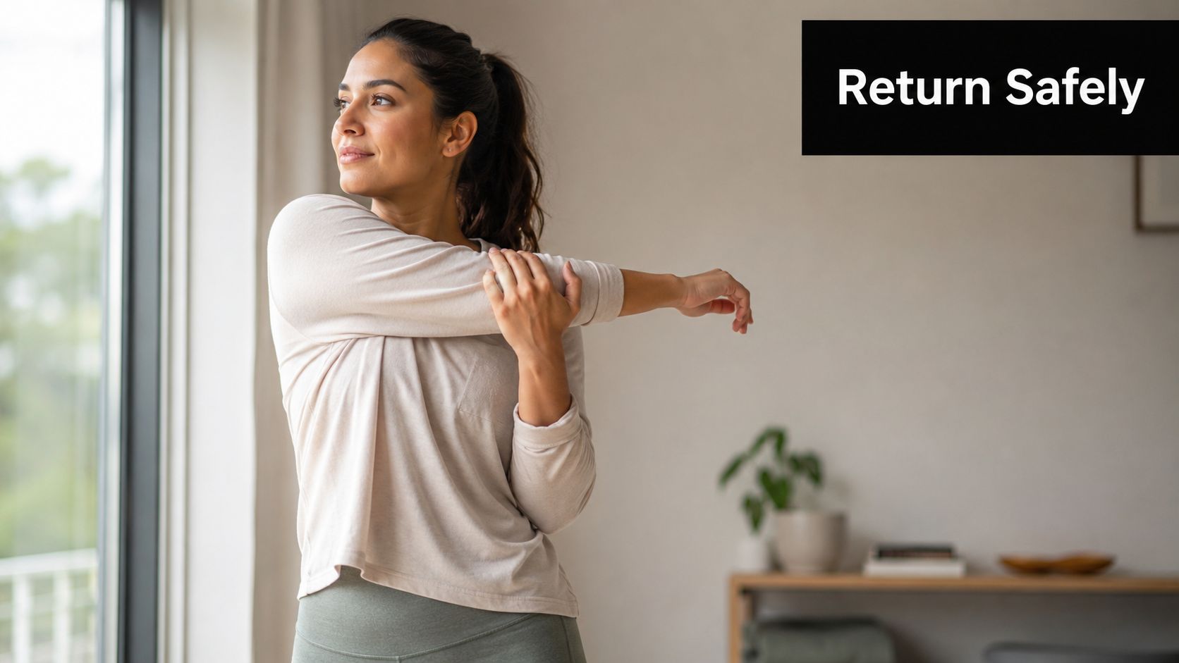 A woman stretching her arm while recovering after breast augmentation surgery in a bright home setting.