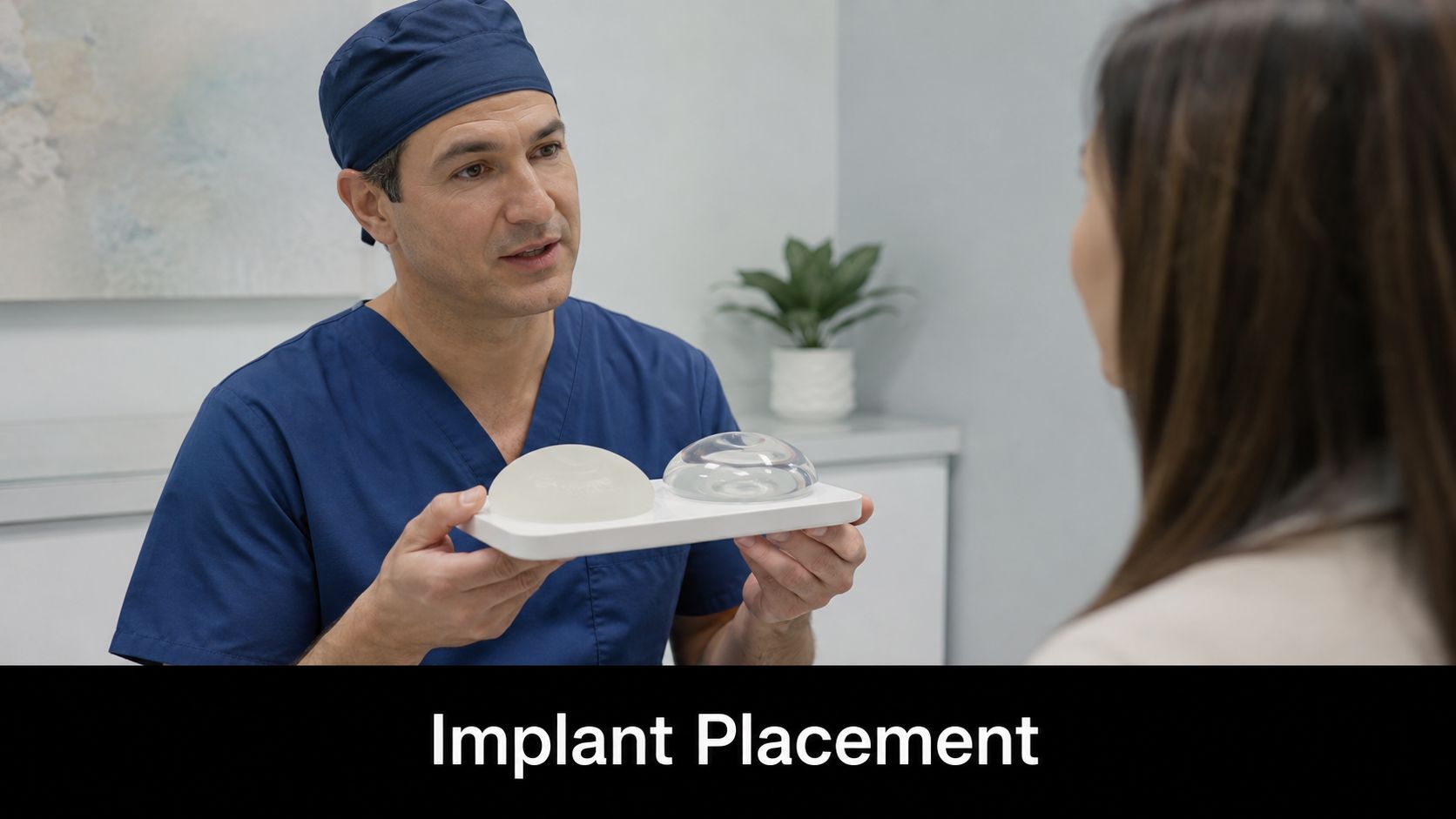 A plastic surgeon discusses breast implant options with a patient during a consultation in a clinic office.