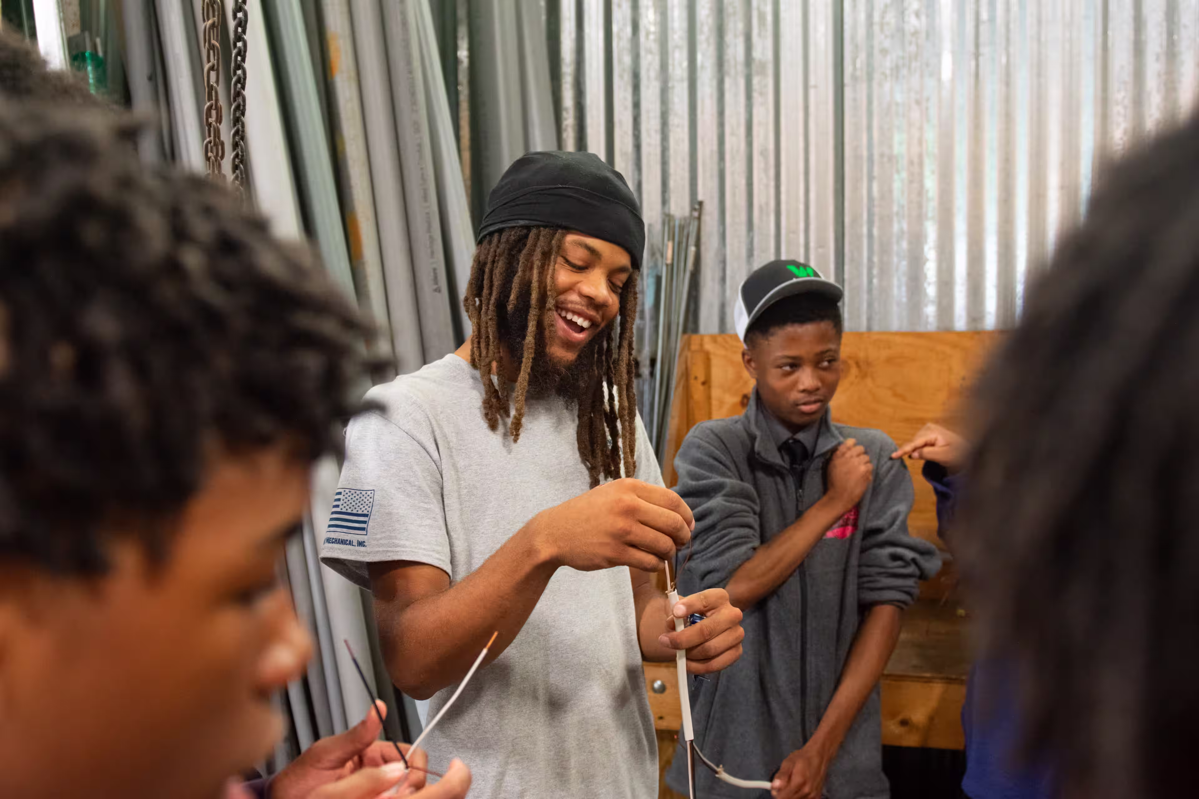 A group of teens learn about the work of electricians through the Powering Future Students Challenge Program offered by the IEC Foundation.
