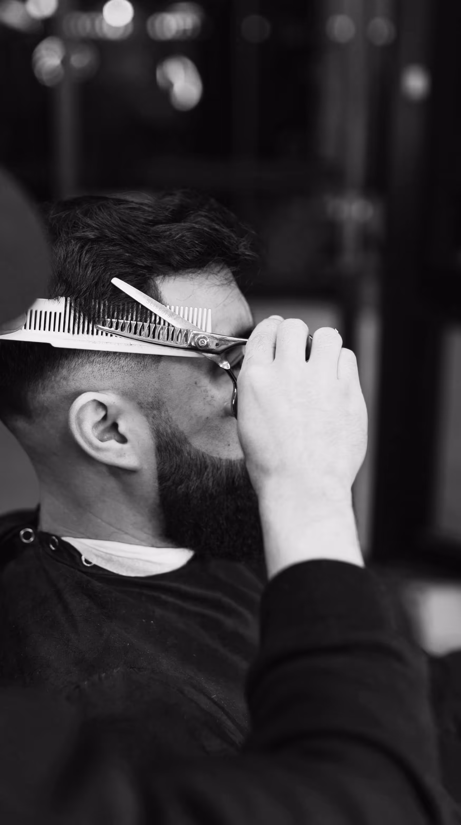 Classic men's haircut with neck shave and styling at The Chair Barbershop in Chicago
