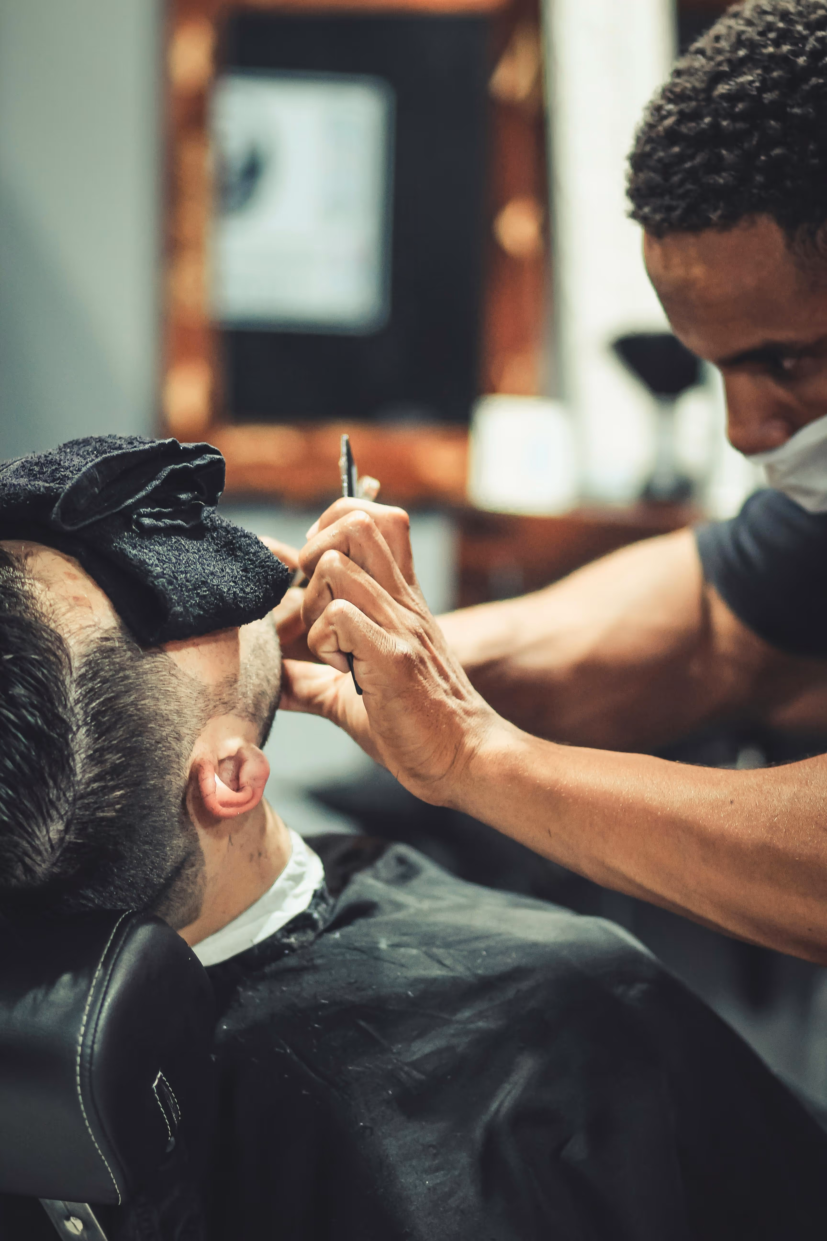 Luxury straight razor shave and hot towel facial service at The Chair Barbershop Chicago