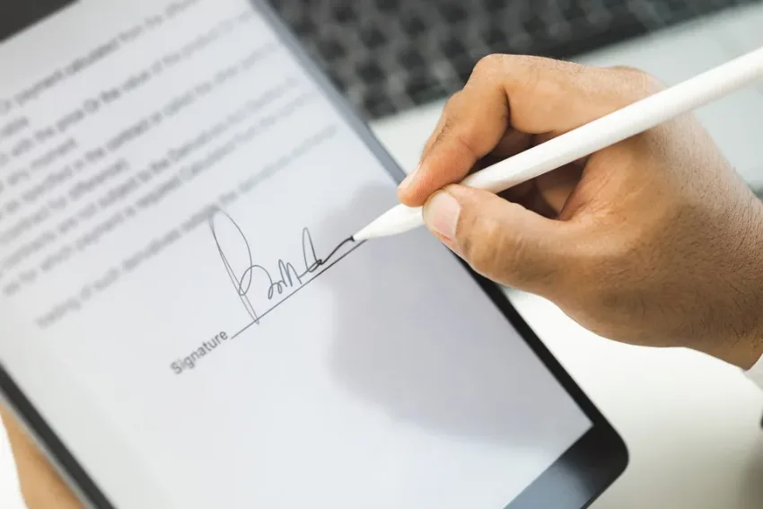 Business user reviewing an electronic invoice workflow on a tablet