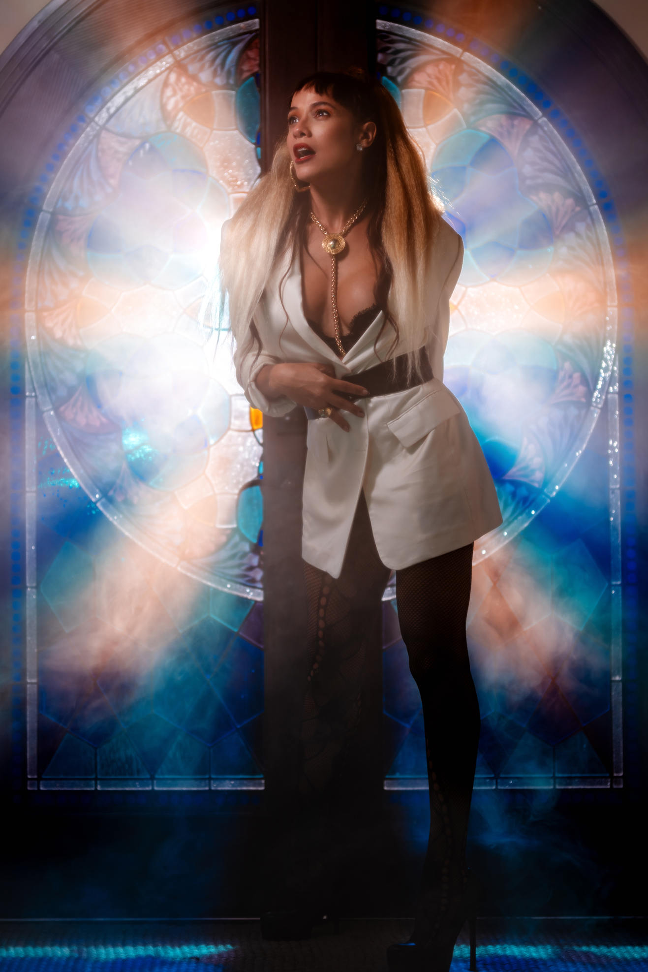 Dania Ramirez posing in front of stained glass window for Empyreal Magazine cover shoot