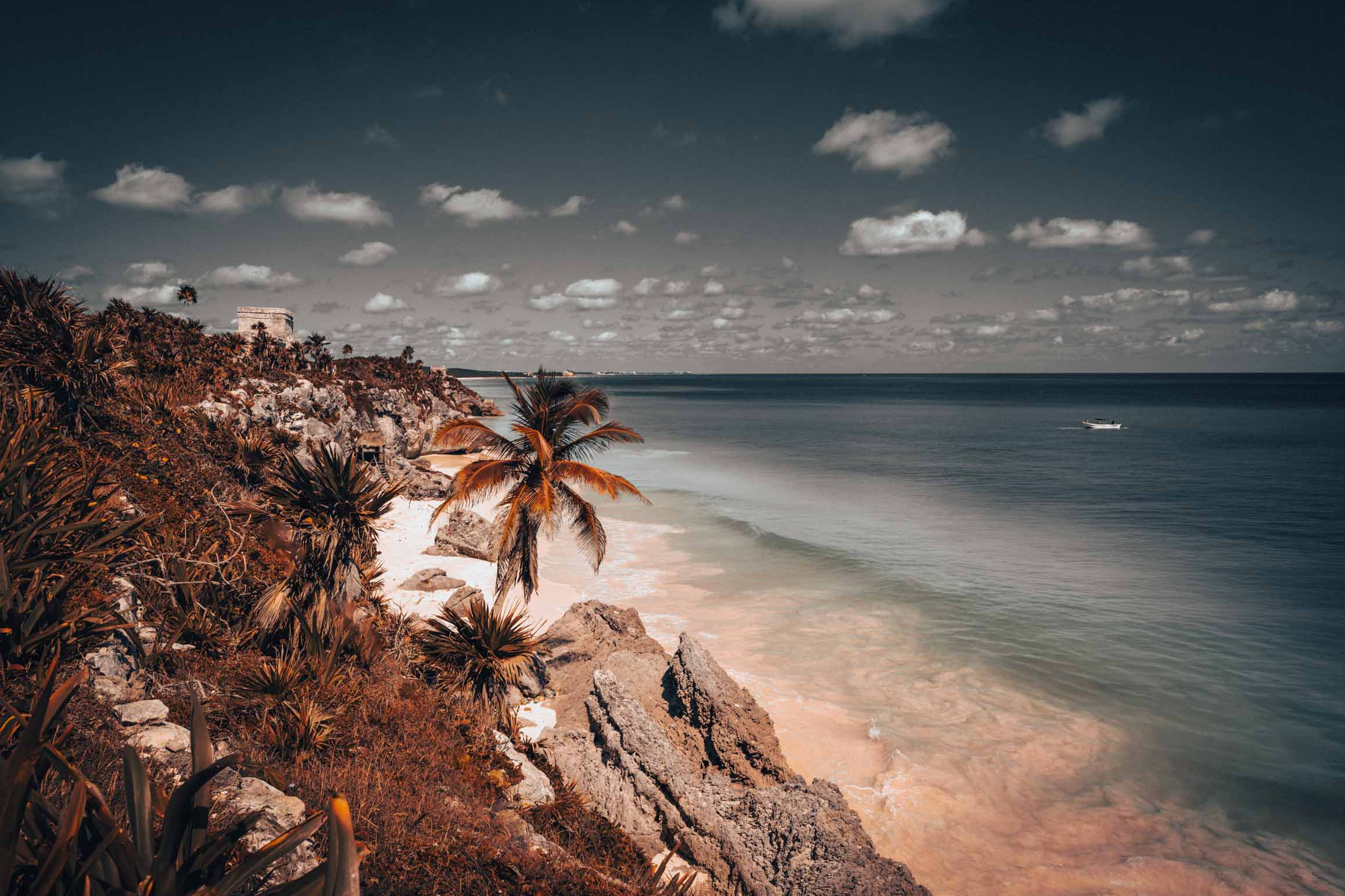 Discover the ancient Maya city of Tulum, where dramatic coastal cliffs, sacred temples, and centuries of history meet the turquoise Caribbean Sea.