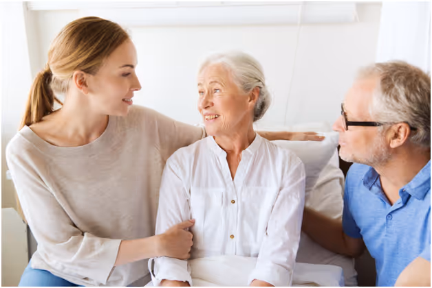 A dementia patient surrounded by her daughter and husband