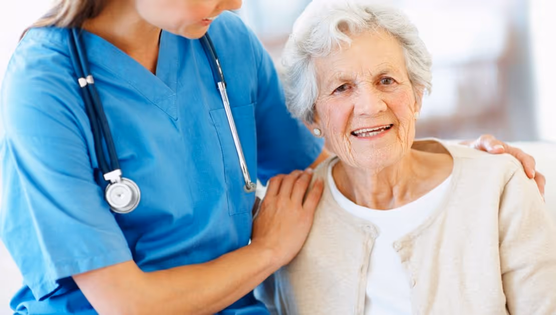 A carer is hugging a senior patient with dementia