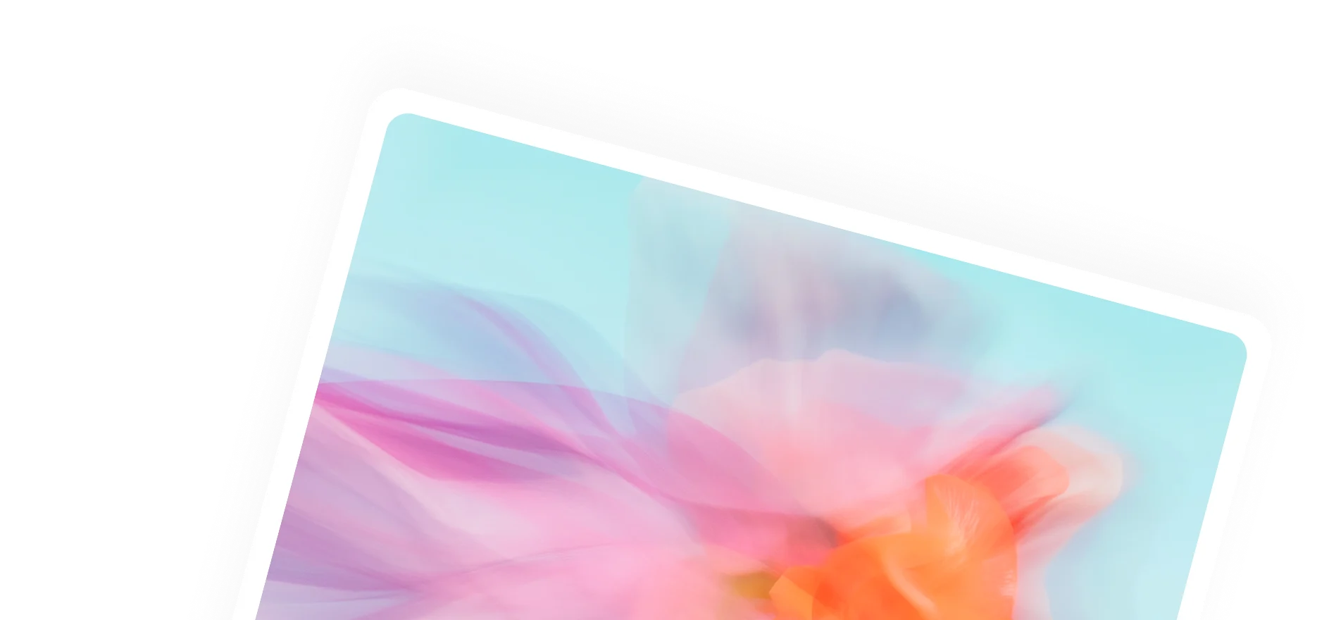 Blurred close-up of a pink and orange flower against a light blue background.