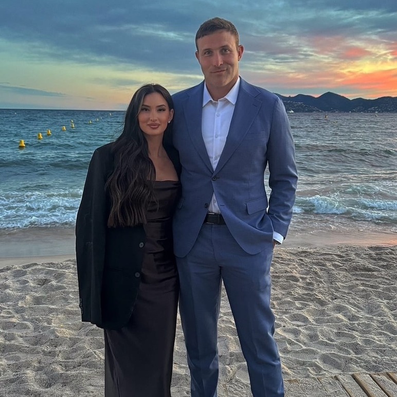 Dr Anthony Chaffee and his wife on the beach at sunset