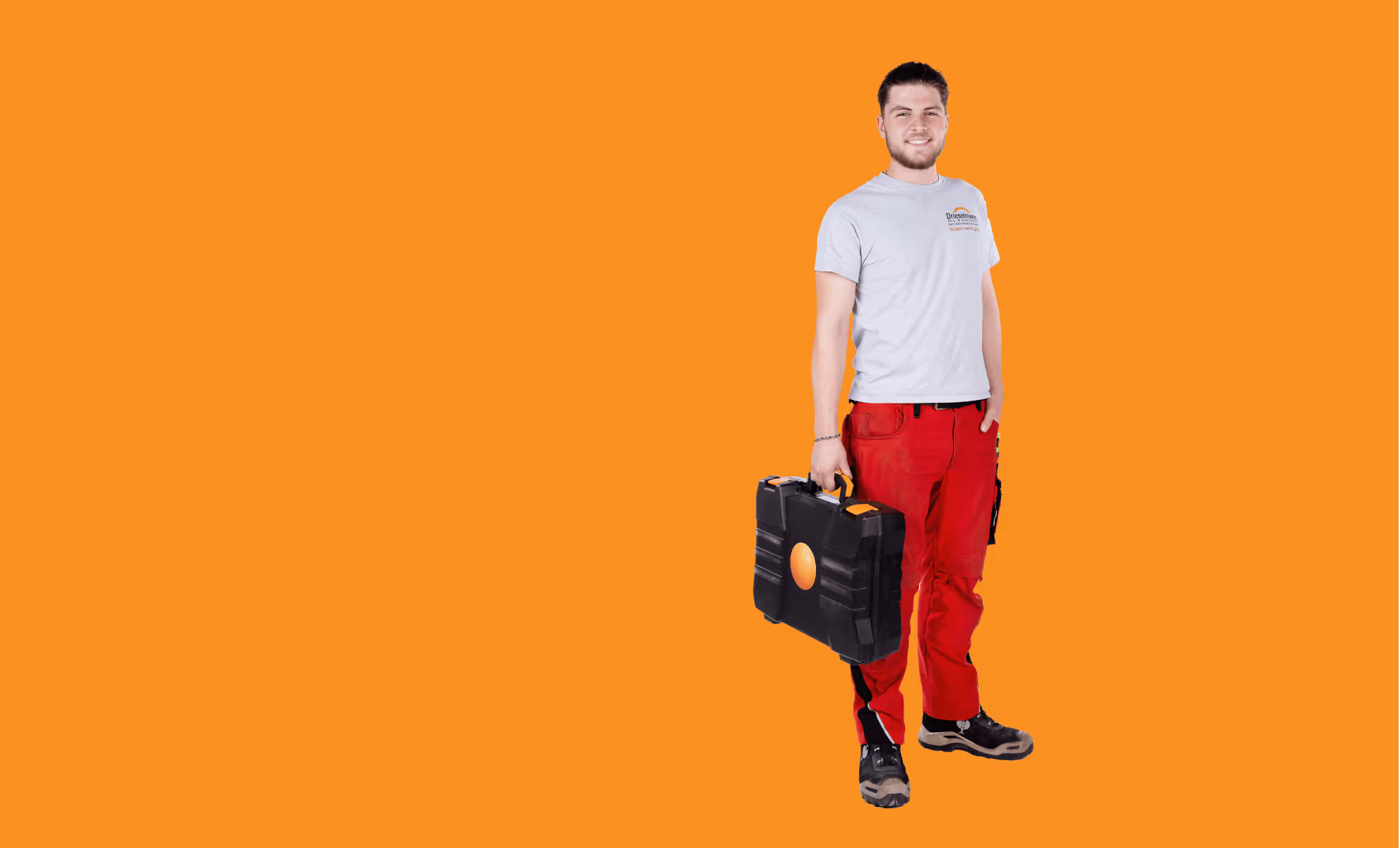Drieselmann Handwerker mit Werkzeugkoffer auf orangem Hintergrund