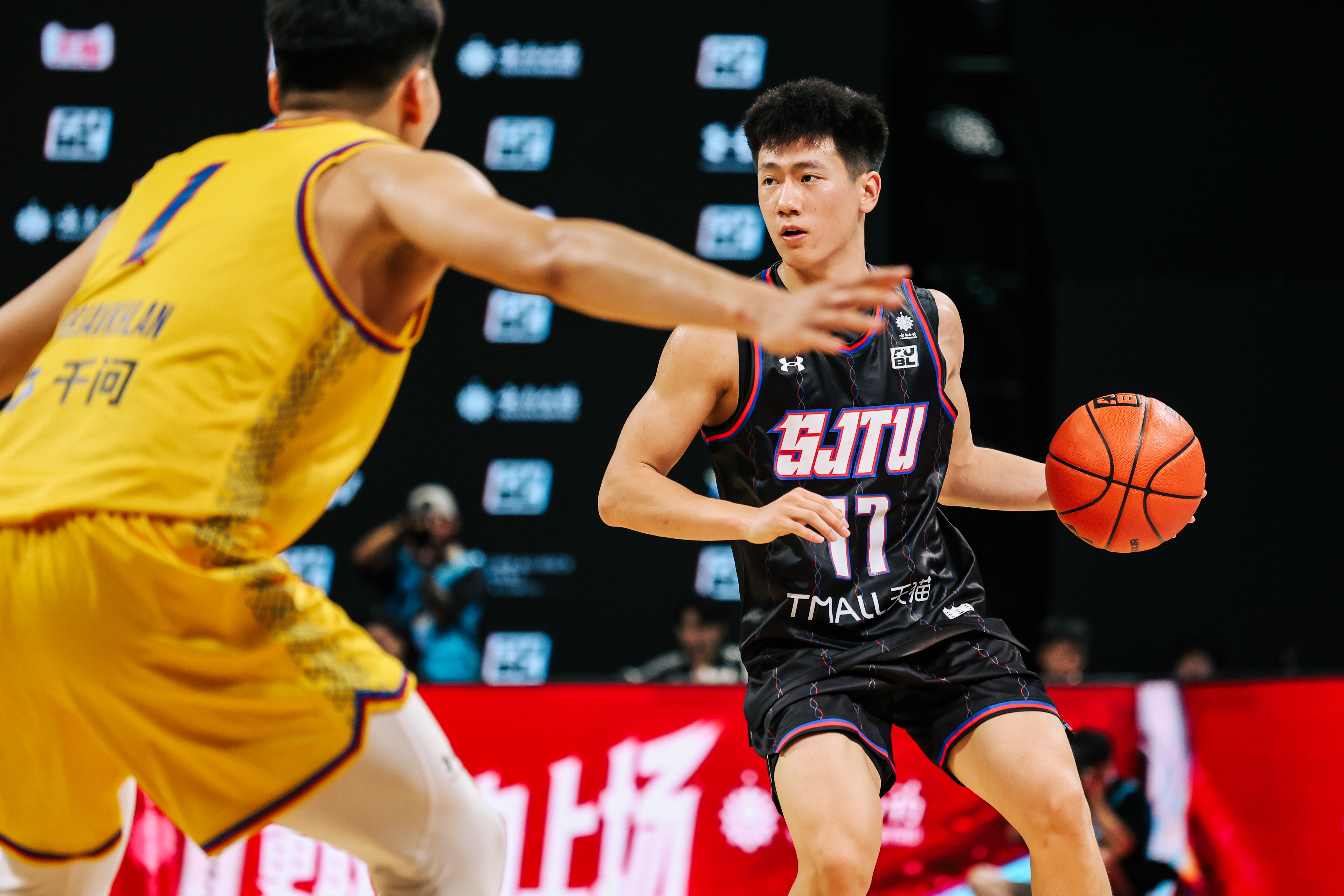 Shanghai Jiao Tong Hold Off NUM, 61-53, in Group D Opener