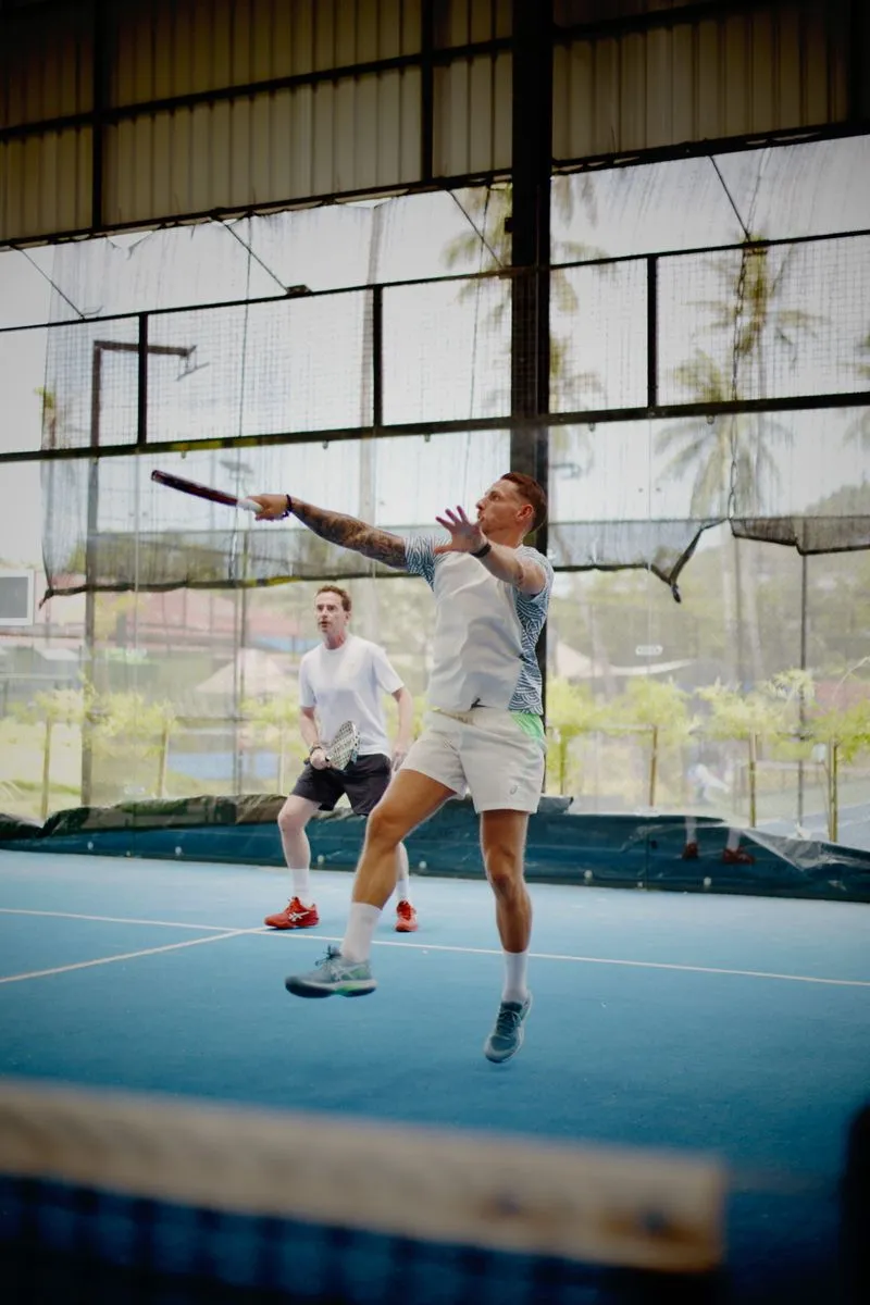 Two players at the net during a coached session in Koh Samui